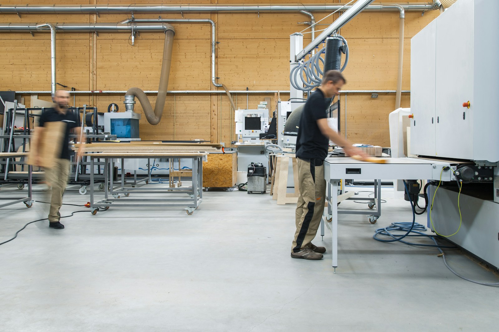 selective focus photography of man using angle grinder